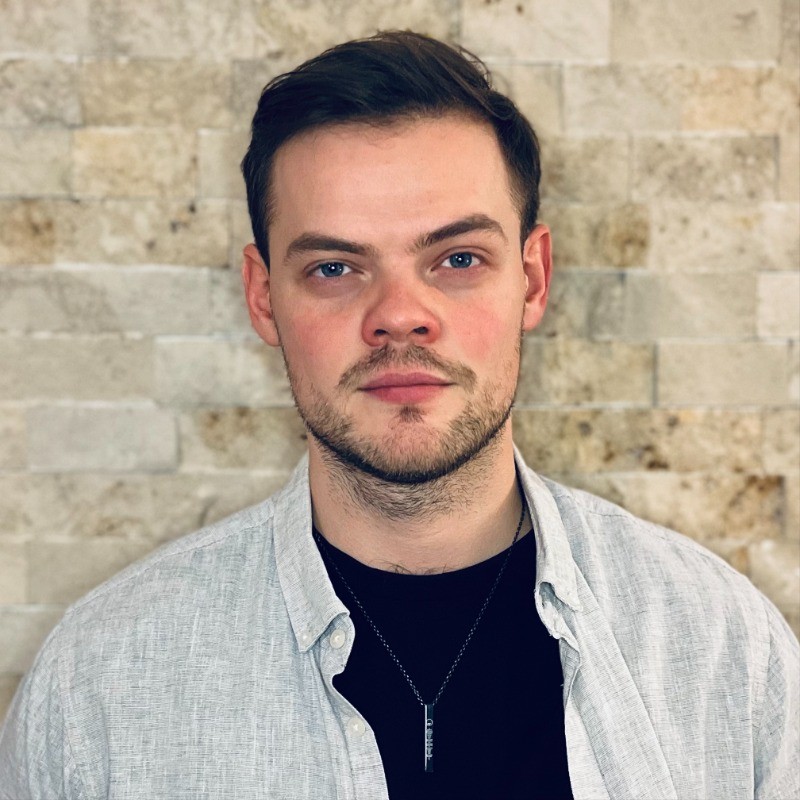 Professional headshot of Tamas Illes, Co-Instructor and AI Consultant with teaching experience at Semmelweis University and International Business School